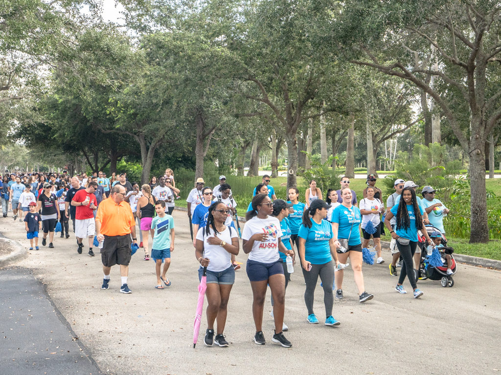 Group of supporters for autism awareness walking at Autism Speaks Walk. 